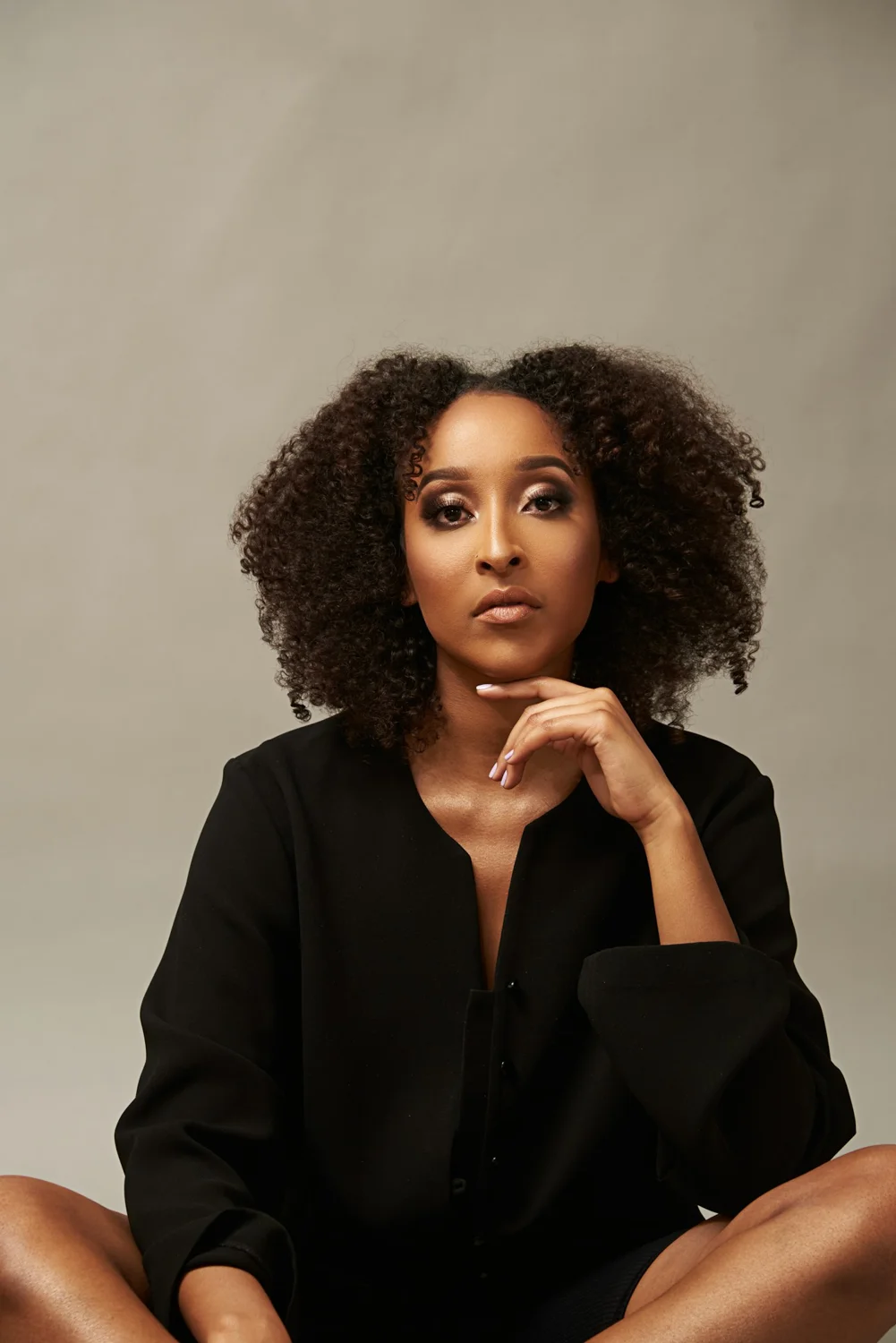 Editorial portrait of a woman wearing a black blazer
